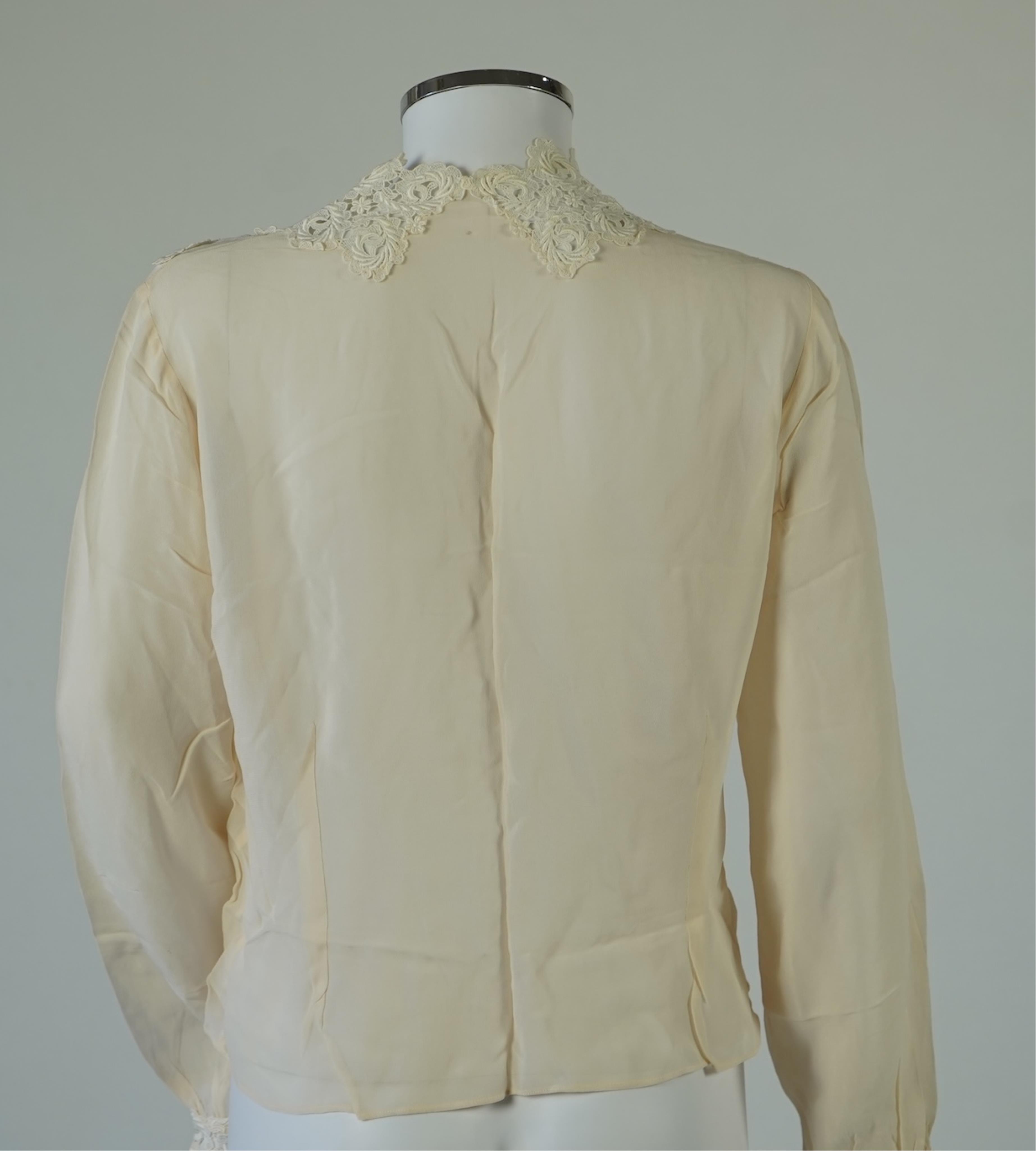 A 1940’s-50’s short sleeve lime green silk embroidered blouse, a pale pink silk crepe long sleeved blouse with white lace and a late 19th century navy silk chiffon blouse. Condition - the navy blouse is fragile but may b